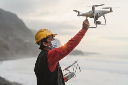 male-engineer-doing-inspection-using-drone-1